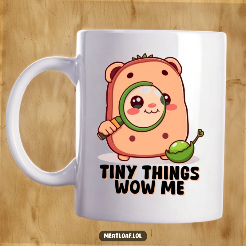 Funny mug showing a meatloaf character intently peering through a magnifying glass at a minuscule pea, full of curiosity.