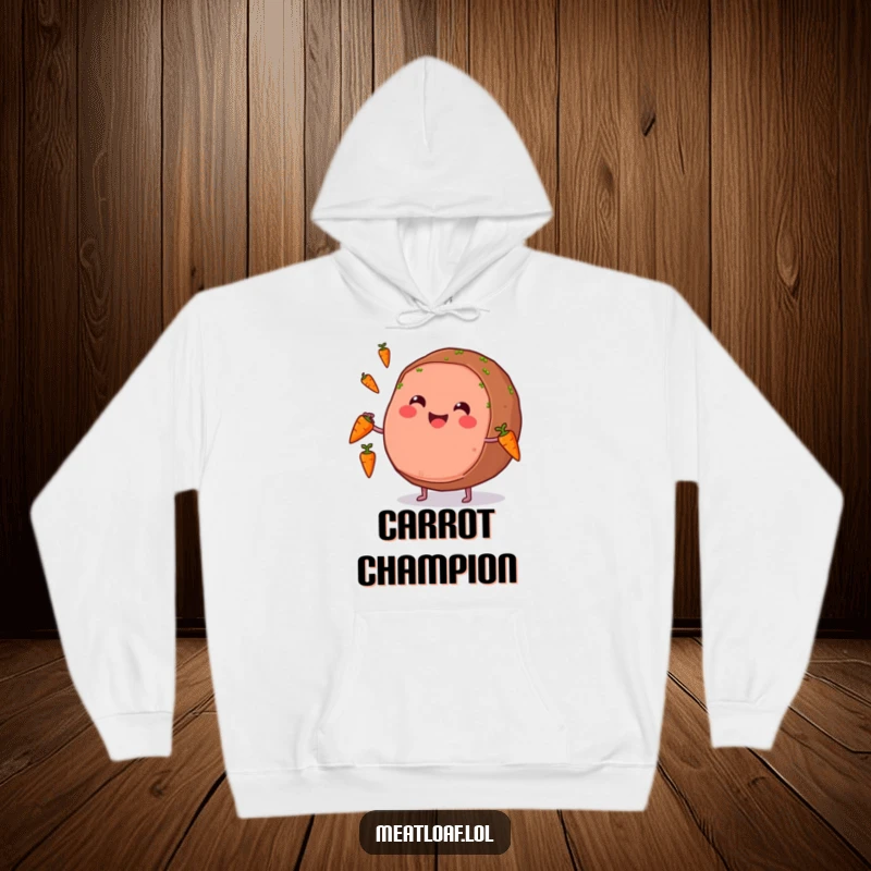 Funny hoodie featuring a round meatloaf with a wide smile juggling carrots, radiating cheerful and humorous energy.