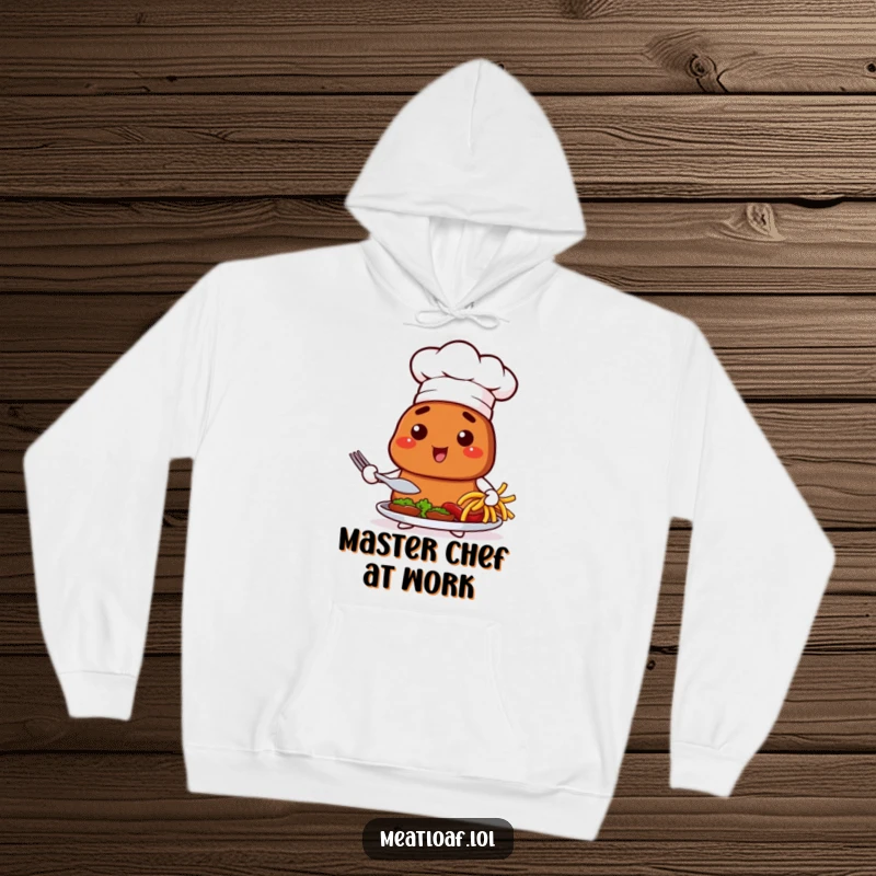 Funny hoodie with a meatloaf character in a chef hat, proudly presenting a dish, perfect for cozy kitchen moments.