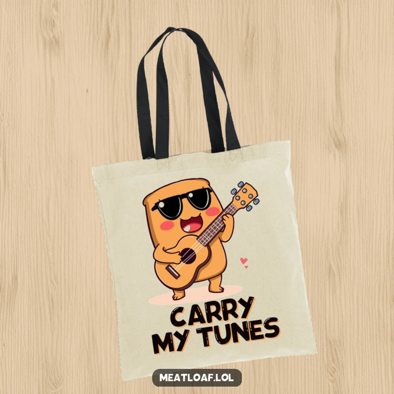Funny tote bag featuring a meatloaf character playing a ukulele made from a spoon, perfect for music lovers.